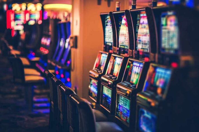 shutterstock_763298764 Row of slot machines in a casino